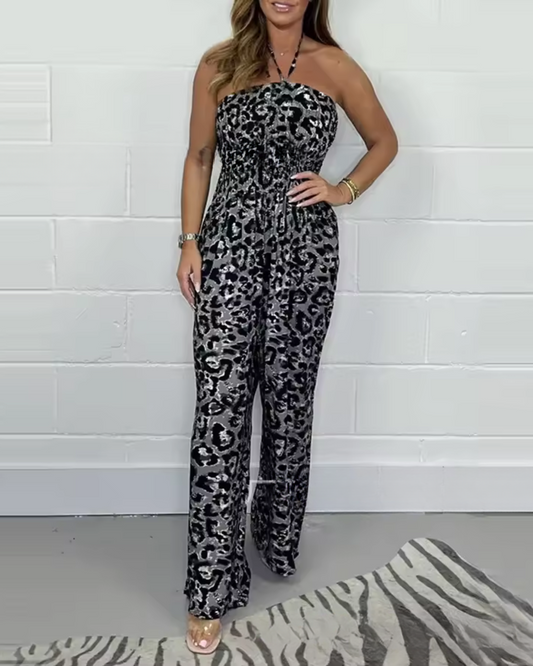 Macacão estampado sem salto com decote halter e pernas compridas. 