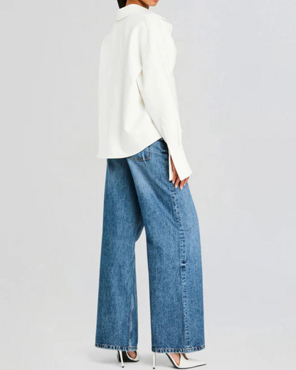 Blusa com mangas comprimidas, design estruturado e corte moderno. 