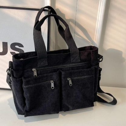 Bolsa Bombazina com vários compartimentos e design casual, ideal para o dia a dia e para viagens.